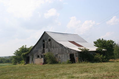 Old barn on grassy field