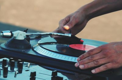 Cropped image of dj playing music