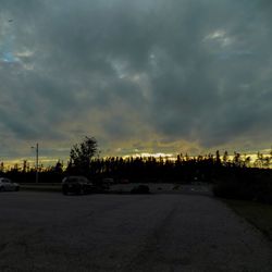 Road against cloudy sky at sunset