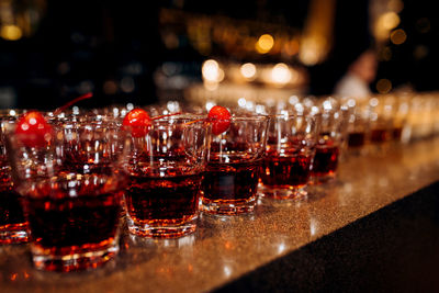 Close-up of wine glasses on table