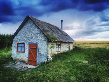 House on field against sky