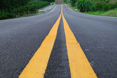 Close-up of dividing line on road
