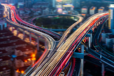 Light trails on highway in city at night