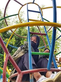 Portrait of girl sitting in playground