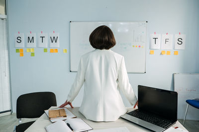 Business planning strategy. businesswoman, manager standing in office in front of the chart white