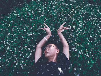 Young man standing in plant