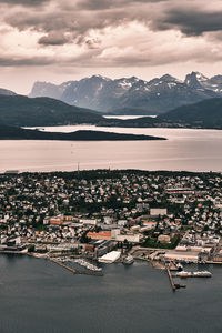 High angle view of townscape and mountains against sky