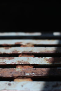 Close-up of rusty metal on wood