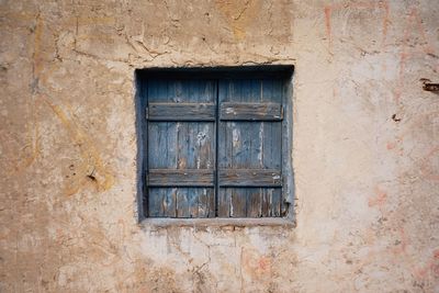 Closed window of old building