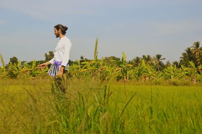 Full length of man on field against sky