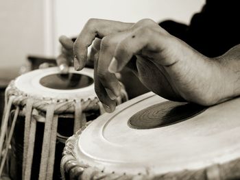 Cropped hands playing musical instruments