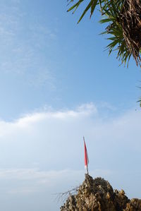 Low angle view of flag against sky