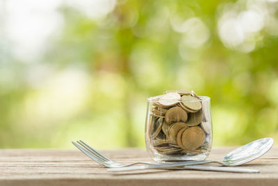 Close-up of wineglass on table against blurred background