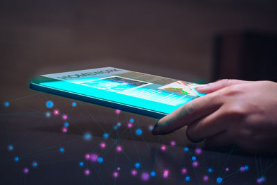 Midsection of person using mobile phone