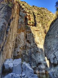 Rock formations on mountain against sky