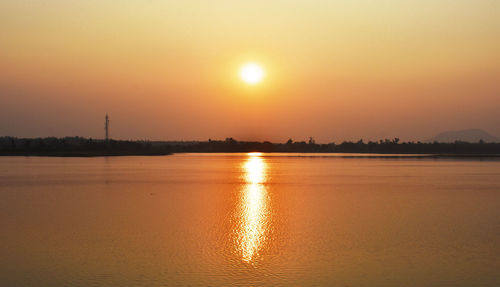 Scenic view of sea against romantic sky at sunset