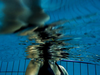 Low section of woman in swimming pool