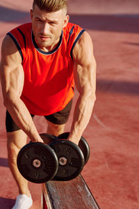 Low section of man exercising in gym
