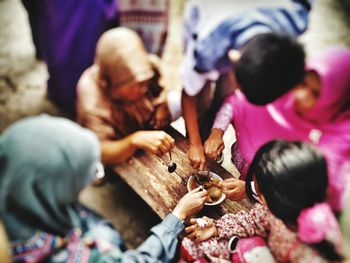 High angle view of people on table