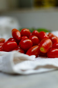 Close-up of cherries in plate on table