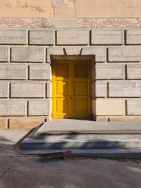 Closed yellow door in montjuïc barcelona