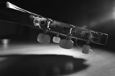 Close-up of guitar on table