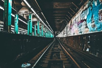 Train on illuminated railroad tracks