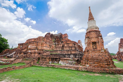 Old temple against cloudy sky