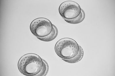 High angle view of drink on table against white background