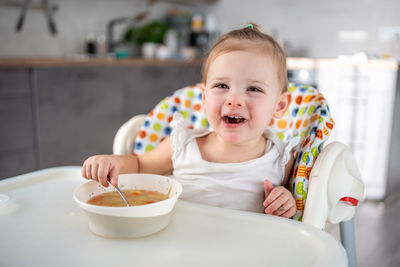 Portrait of cute girl eating food