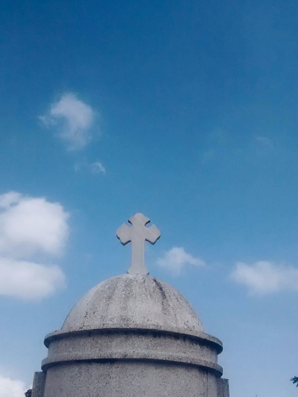 low angle view, built structure, architecture, blue, building exterior, sky, religion, place of worship, statue, sculpture, spirituality, dome, high section, human representation, cloud - sky, church, art and craft, day, cross