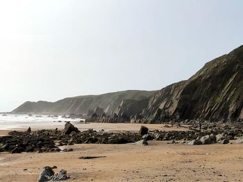 Scenic view of beach against clear sky