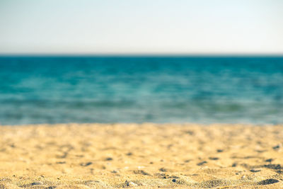 Scenic view of beach against clear sky