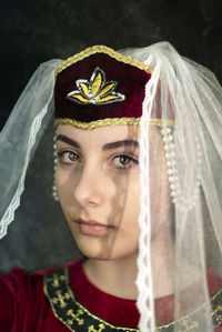 Close-up portrait of a serious young woman