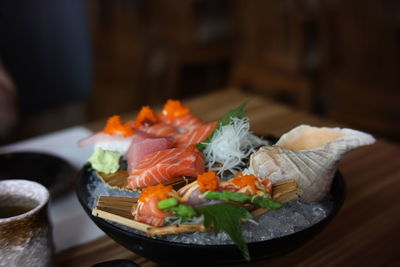 Close-up of fish with vegetables on table