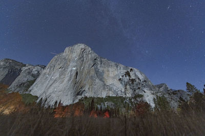 View at night of climbers on el capitan climbing under the stars