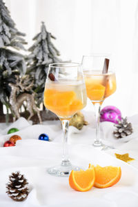 Light christmas spritzer made with orange juice and vodka. the cocktail to start your holiday party