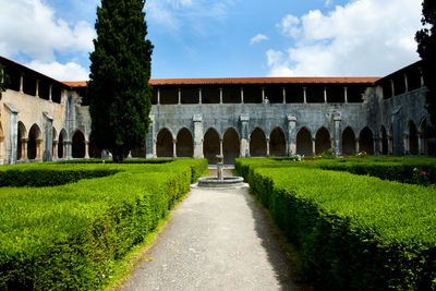 Lawn in garden against sky