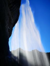 Low angle view of rock formation against sky