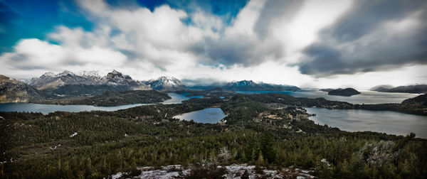 Scenic view of lake and mountains against sky