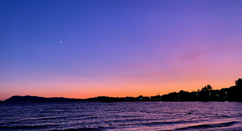 Scenic view of sea against sky at sunset