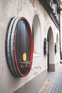 Close-up of open door on wall of building