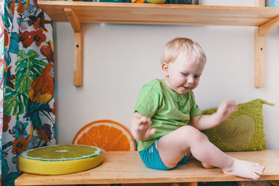 Cute boy sitting at home