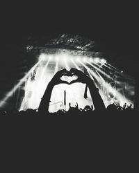 Silhouette people at music concert