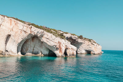 Scenic view of sea against clear blue sky