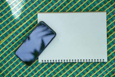 High angle view of mobile phone on table