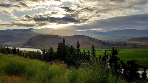 Scenic view of landscape against sky during sunset