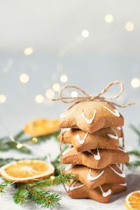 Christmas food. homemade gingerbread cookies, pine branches, cones, dried oranges. 