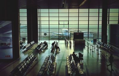 High angle view of people walking at airport