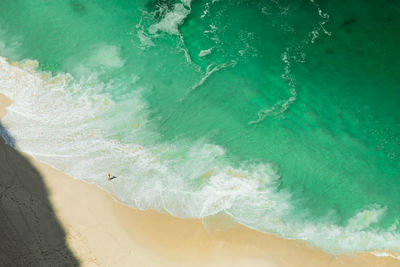 Aerial view of woman standing on beach